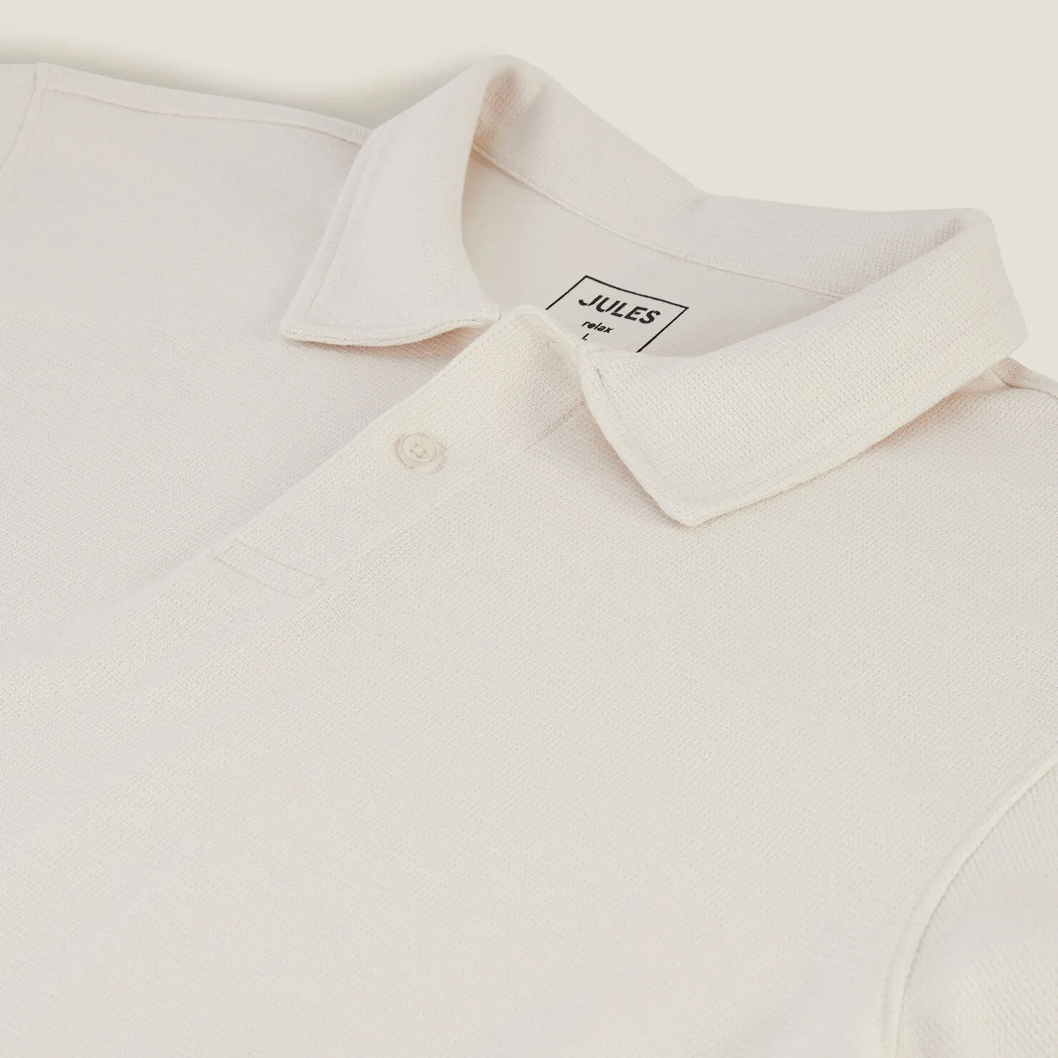 Effen relaxed polo met korte mouwen in textuurstof