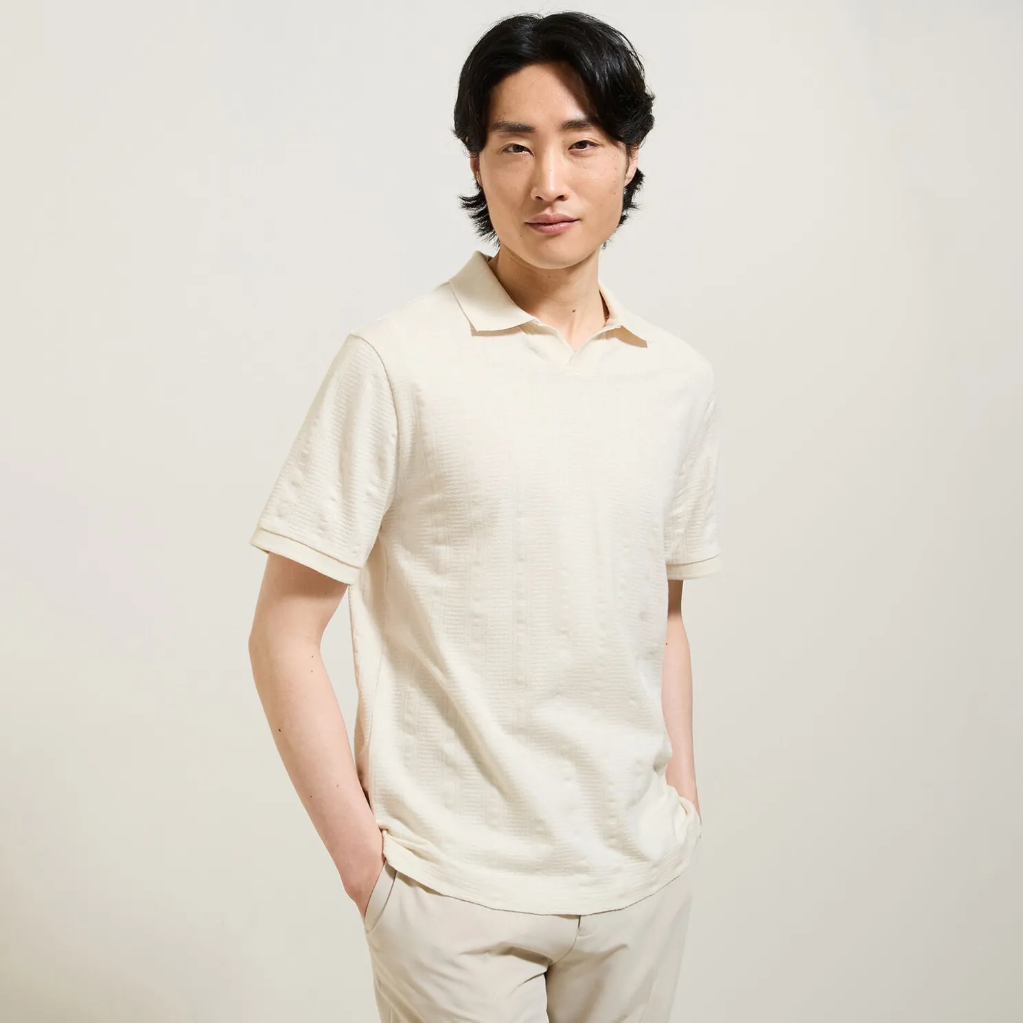 Polo in textuurstof met korte mouwen en resortkraa