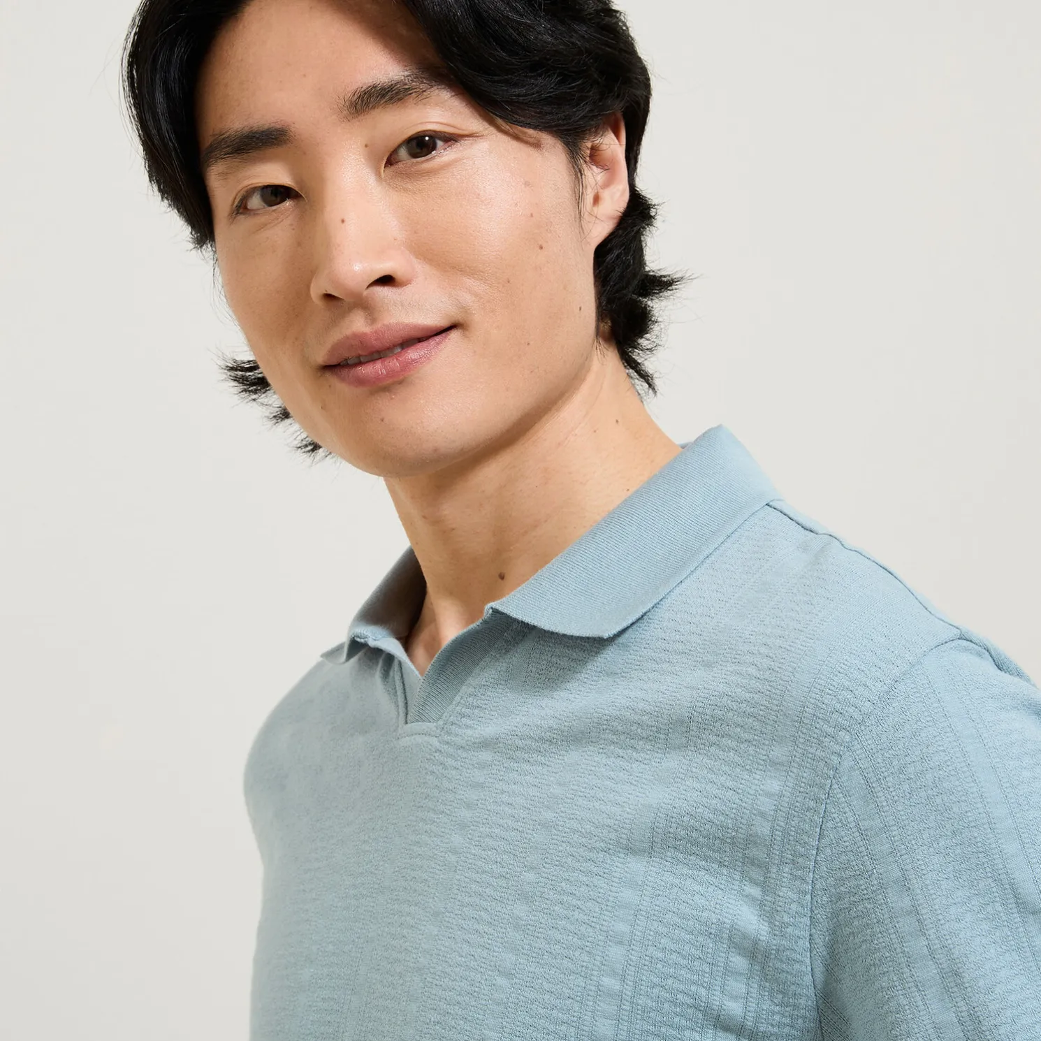 Polo in textuurstof met korte mouwen en resortkraa