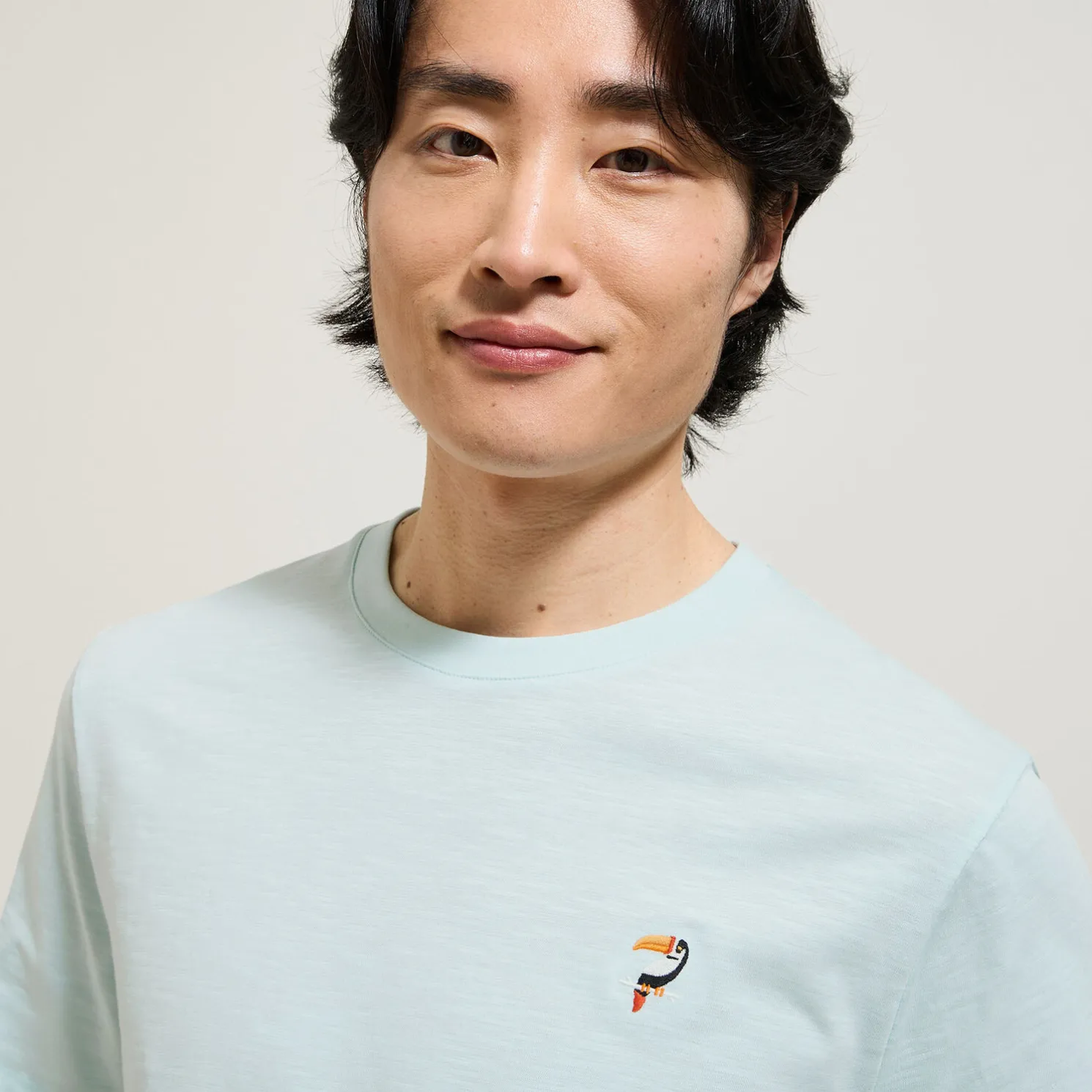 T-shirt in gevlamde stof met borduursel op de bors